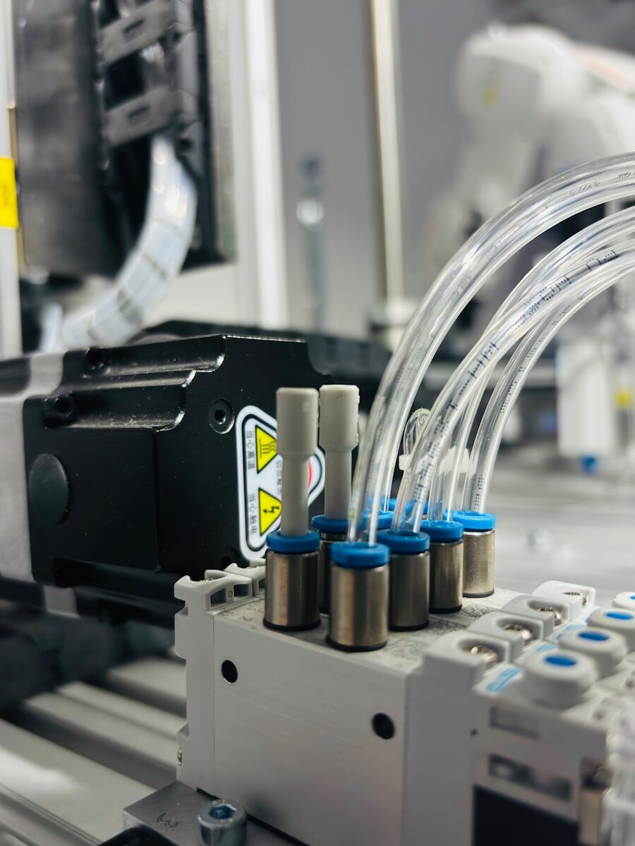 Close-up of industrial pneumatic system with tubes.